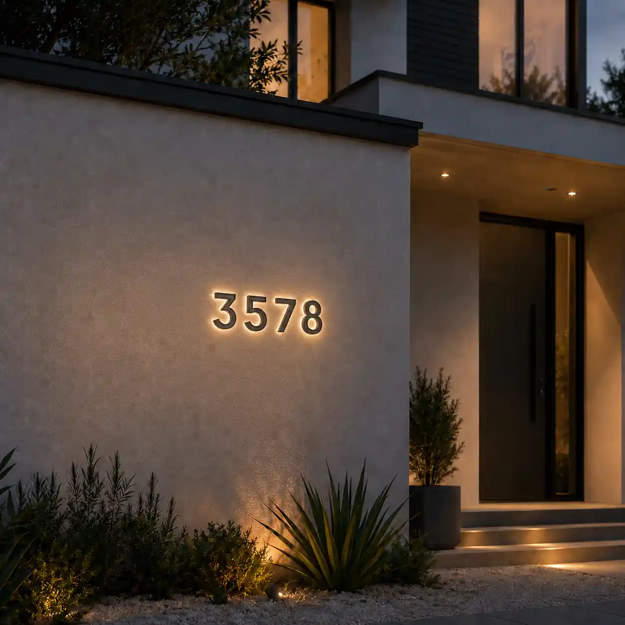 wireless solar illuminated house number 3578 mounted on the exterior wall of the villa's front door
